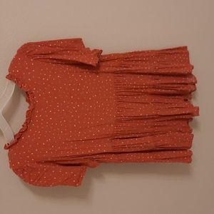 Orange dotted peplum top